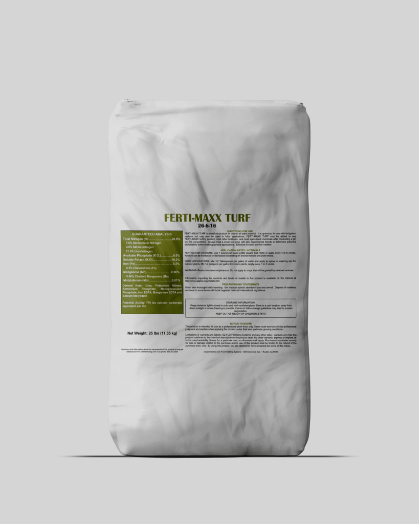 A white bag labeled "Ferti-Maxx Turf 24-4-10" with detailed product information, import 2958, and guaranteed analysis printed on the front.