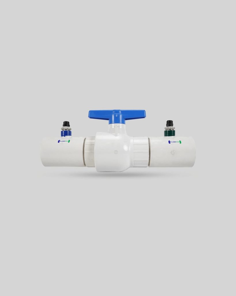 White PVC pipe assembly with a central blue-handled valve and two small black fittings on either side, shown against a plain gray background. An import placeholder for 1128 is visible near one of the fittings.