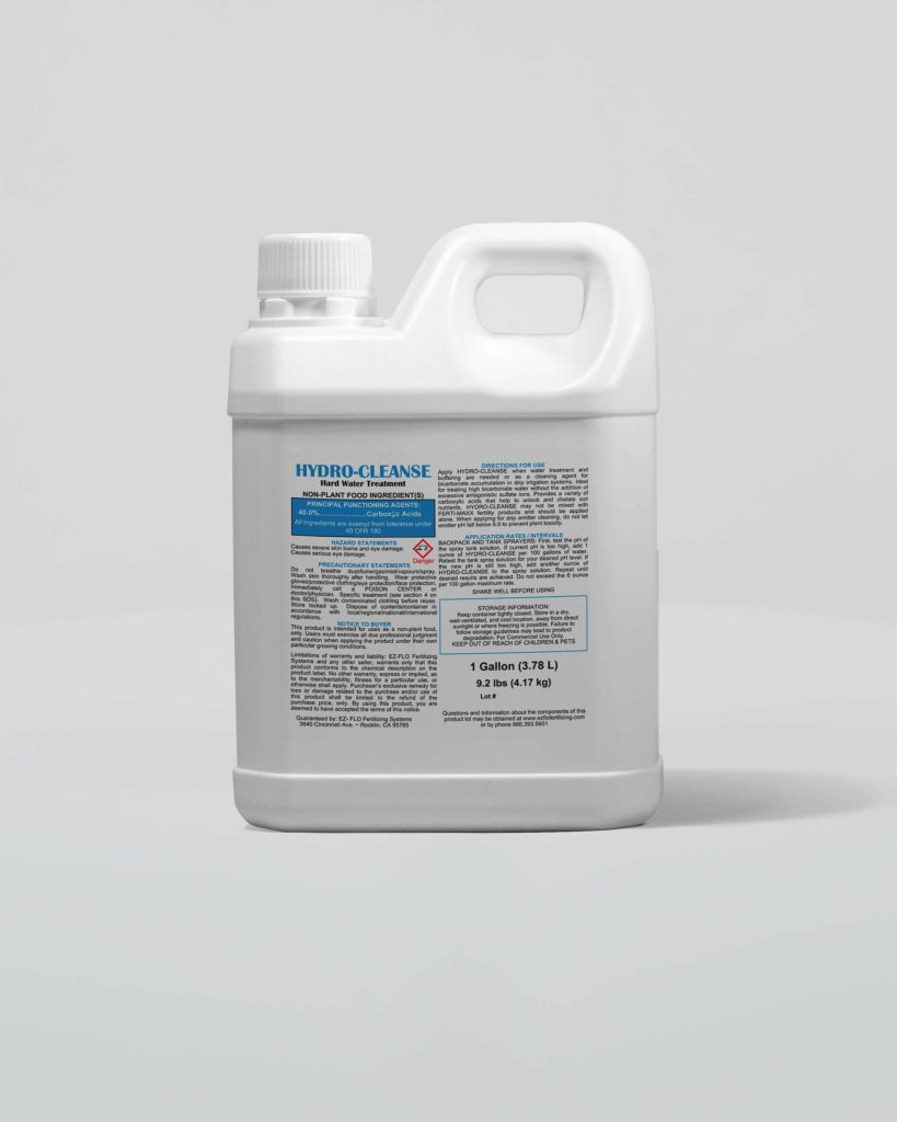 A white plastic gallon container labeled "Hydro-Cleanse 2989" with text instructions and warnings on the front, set against a plain light gray background.
