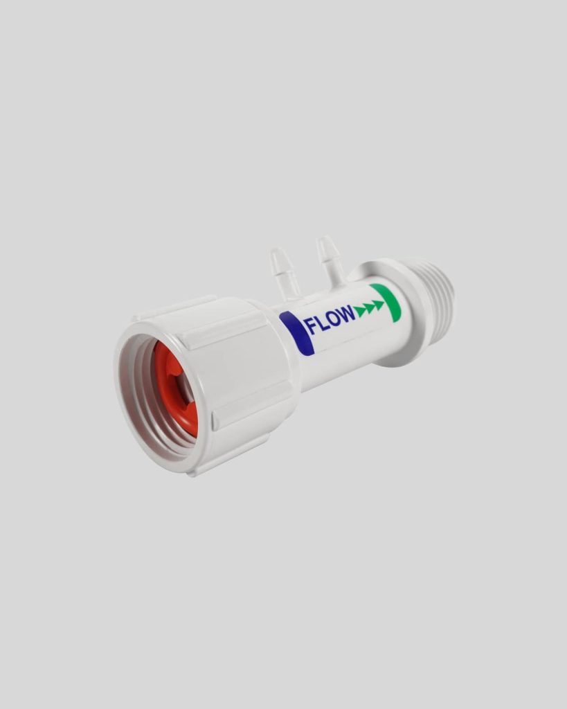 White plastic flow control valve, Import placeholder 1123, with a threaded end, two small side ports, and a blue "FLOW" label with green arrows indicating the direction.